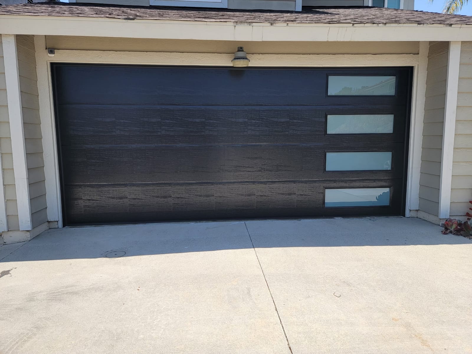 Charcoal insulated garage door installed by AER