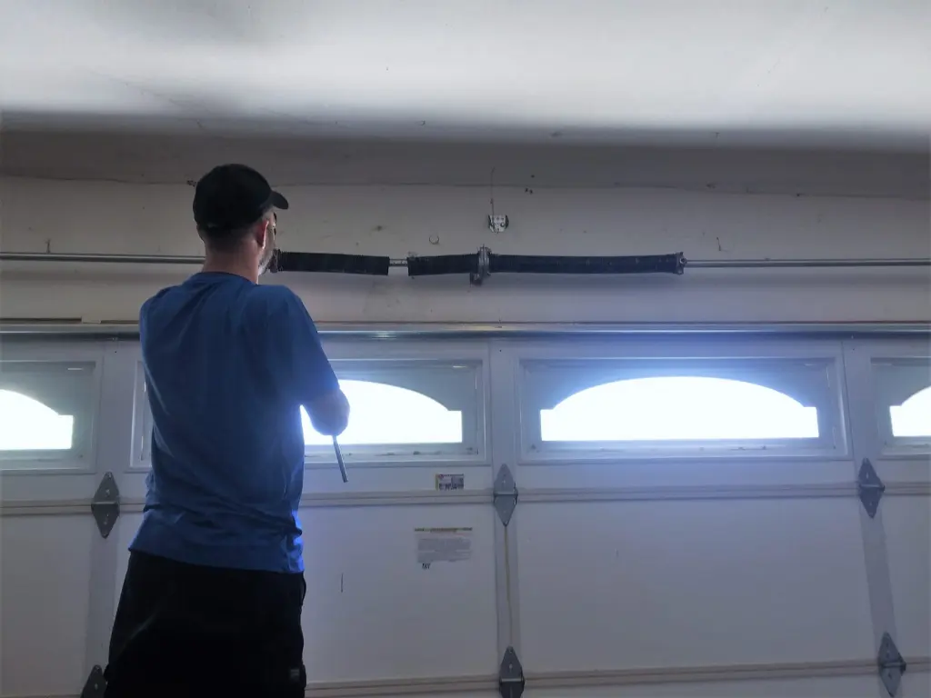 AER technician repairing a garage door in Santa Clarita, CA