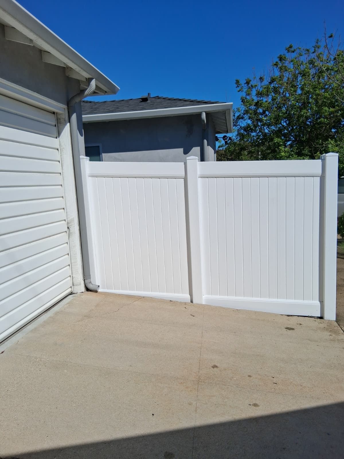 White vinyl privacy fence installed by AER