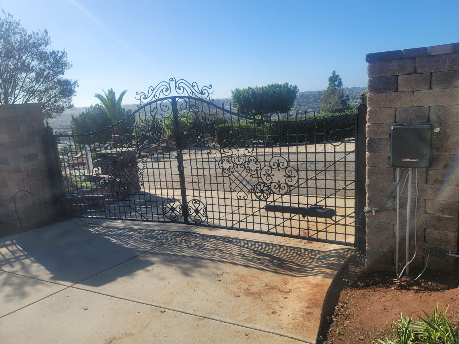 Wrought iron double swing gate with automatic gate operators