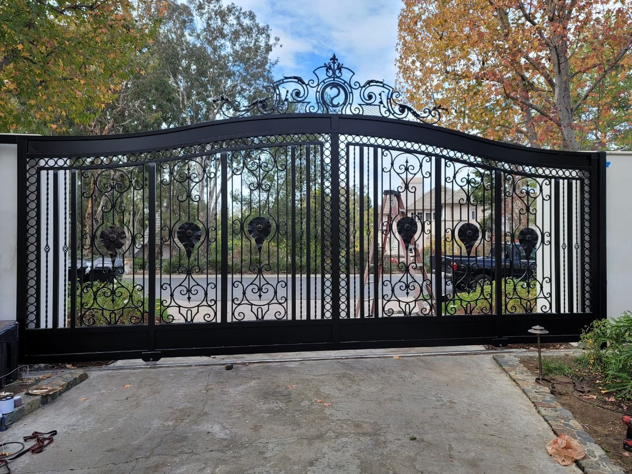 Ornate wrought iron slide gate installed by AER